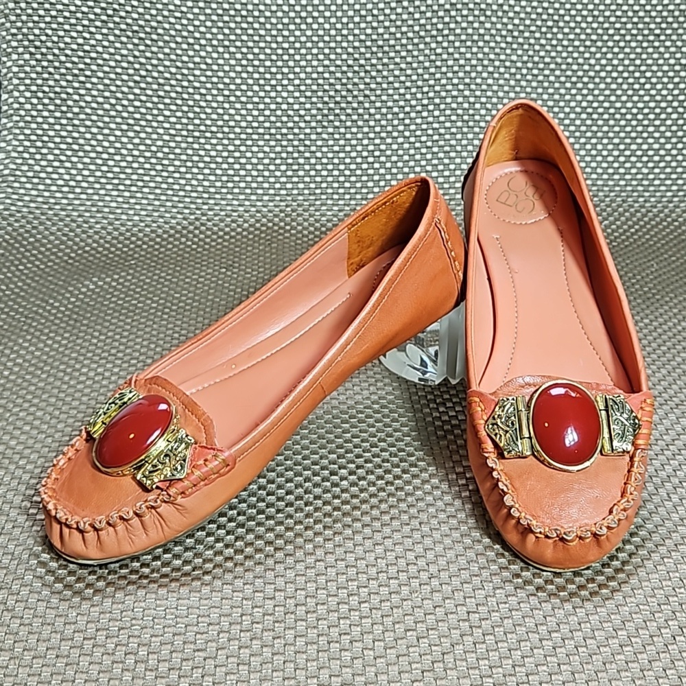 BCBG Leather Loafers.  Gold Embellishment with Coral Colored Jewel.  Size 6.5 B